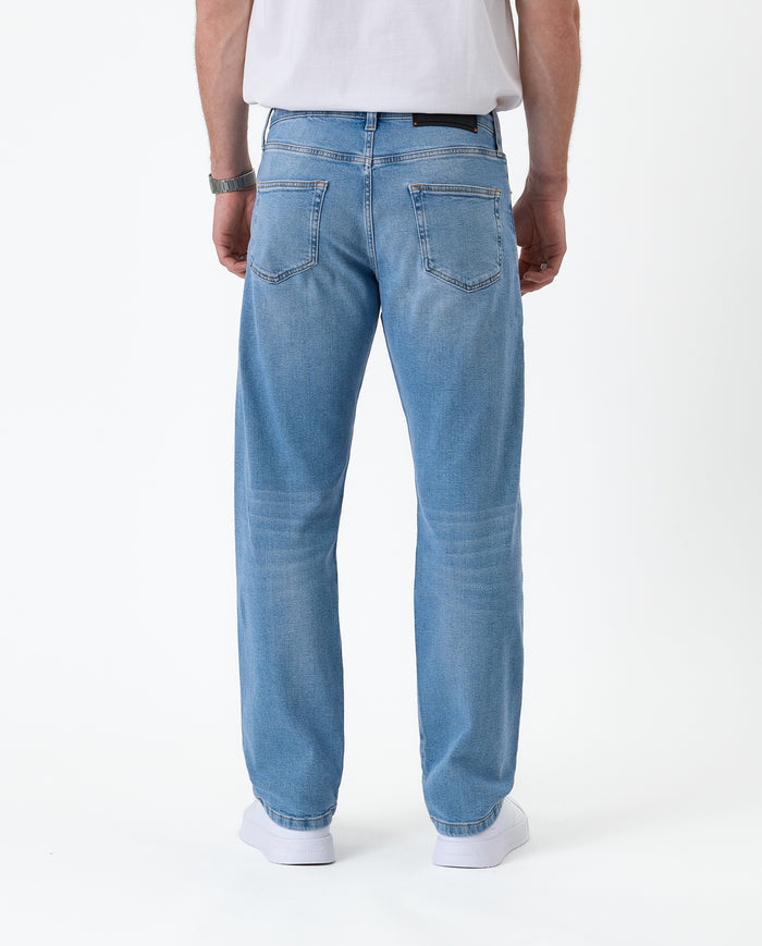The Jeans Classic Straight Fit in light mid blue — back view showing the straight leg silhouette