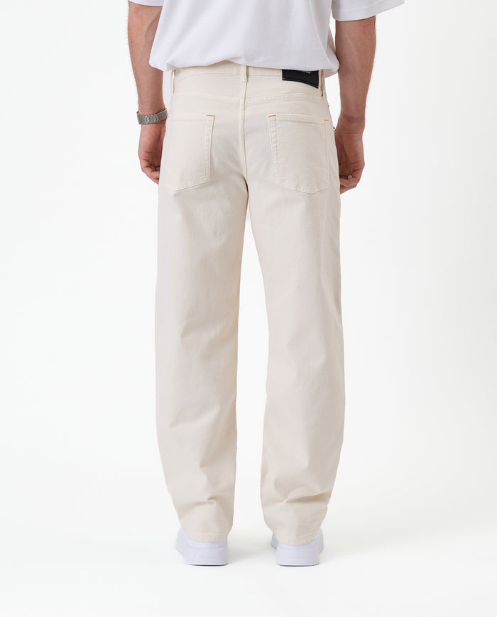 The Jeans Relaxed Straight Fit in ecru — back view against a white background