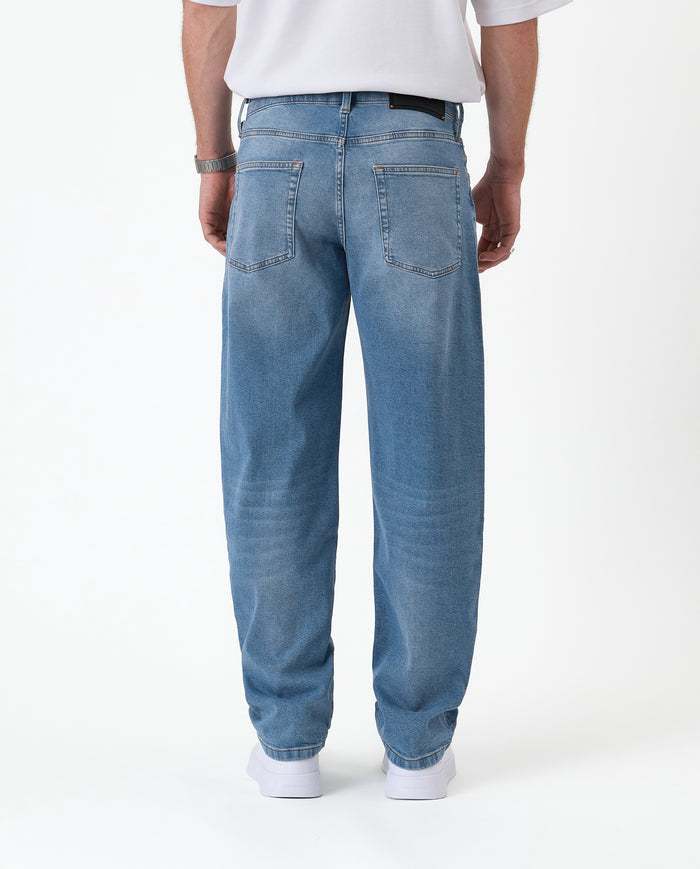 The Jeans Relaxed Straight Fit in light midwash — back view against a white background