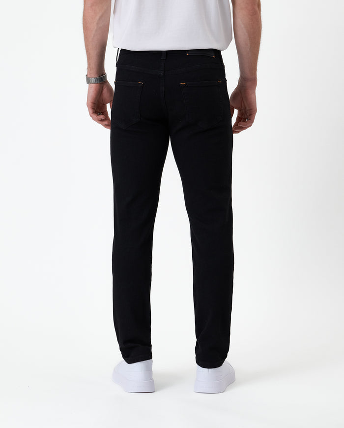 The Jeans Skinny Fit in jet black — back view showing the skinny silhouette