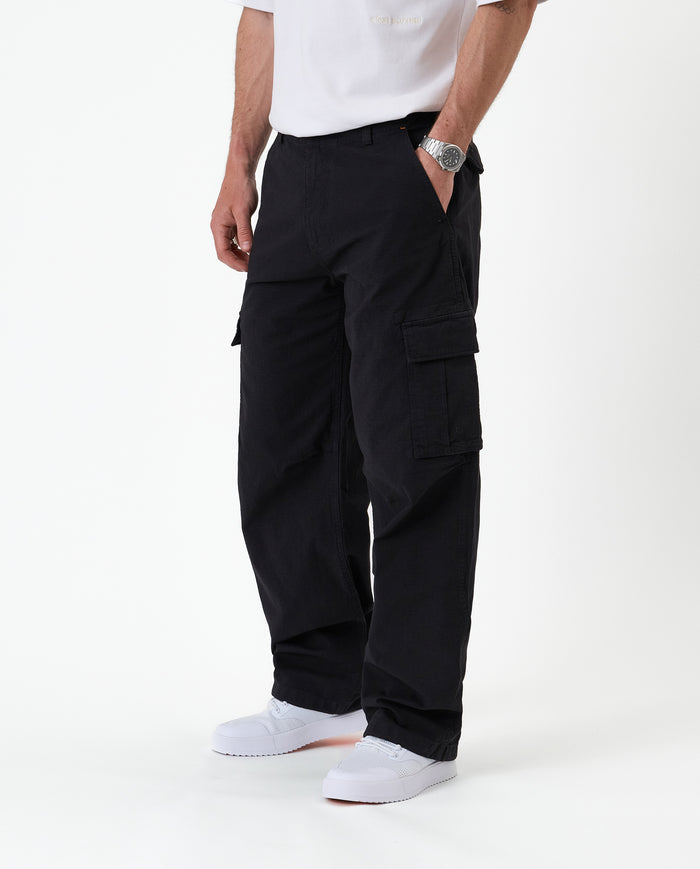 The Monterey Cargo Pant in black — side view showing the cargo flap pocket