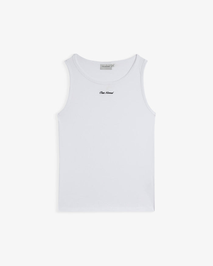 The Ribbed Tank Top in white — front view with the C'est normal script logo