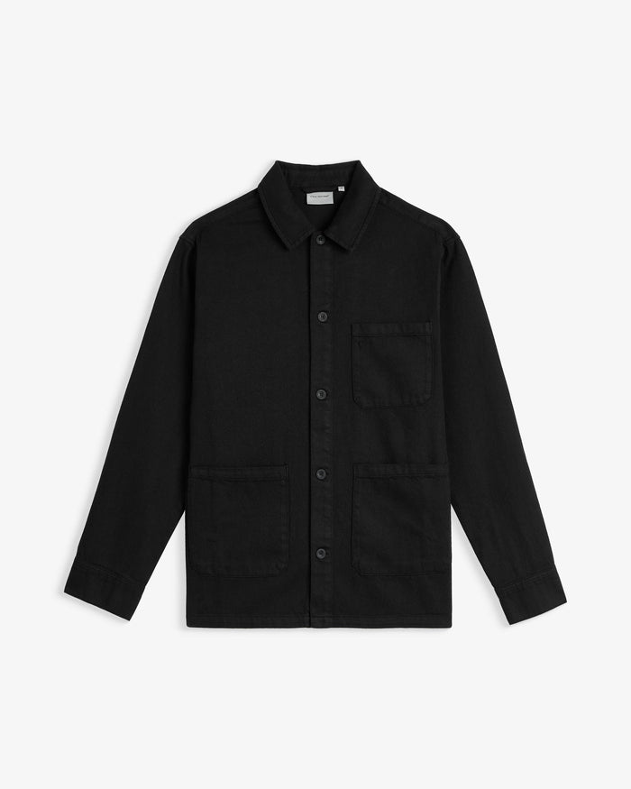 The Workwear Overshirt in black — front view with chest and hip patch pockets