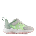 Children's sneaker with green and pink design on a white background