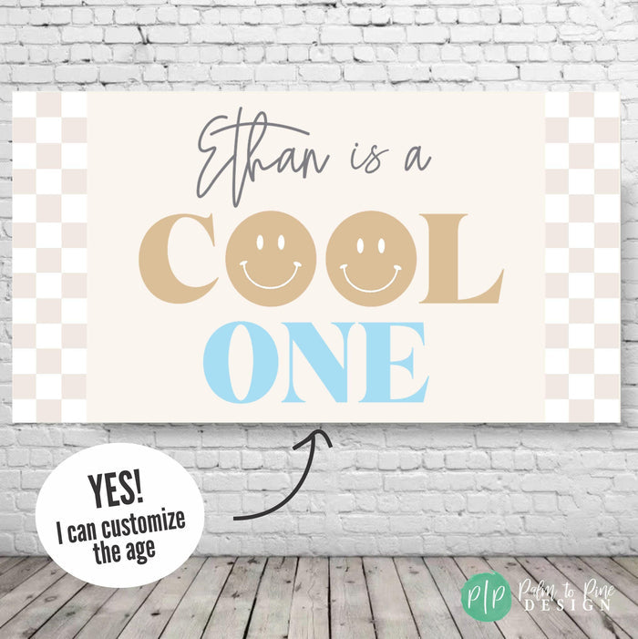 beige and baby blue cool one birthday decor with smiley faces and neutral checkered background