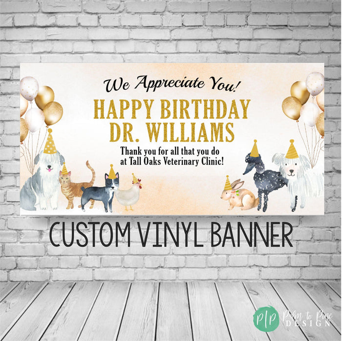 A banner with a birthday message for Dr. Williams, featuring illustrations of dogs, cats, and birds, along with gold balloons.