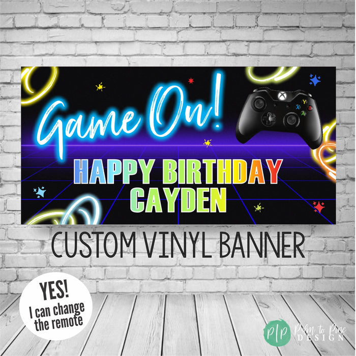 video game birthday banner with neon swirls and remote control game controller