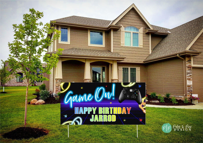 Video game birthday banner with neon swirl background and black game controller, perfect for a gamer-themed party in front yard