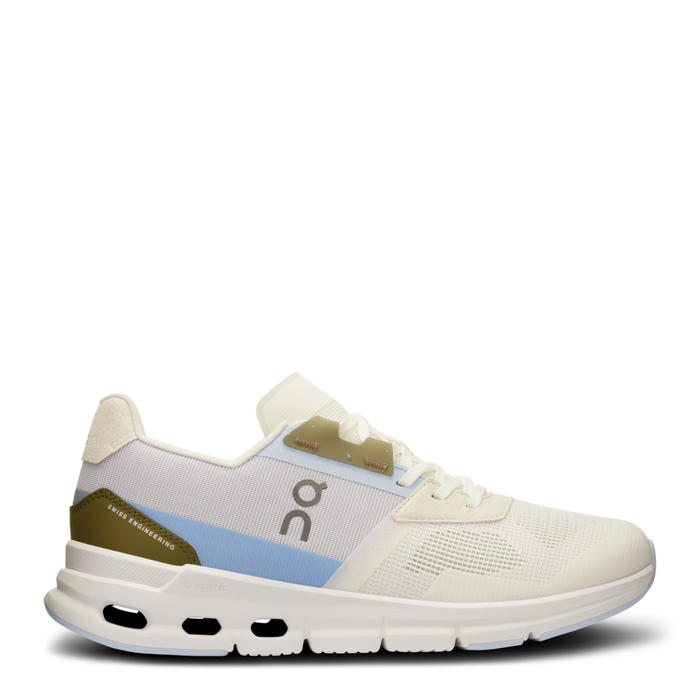 A pair of women's running shoes with a beige, blue, and green color scheme, featuring a mesh upper and a unique sole design.