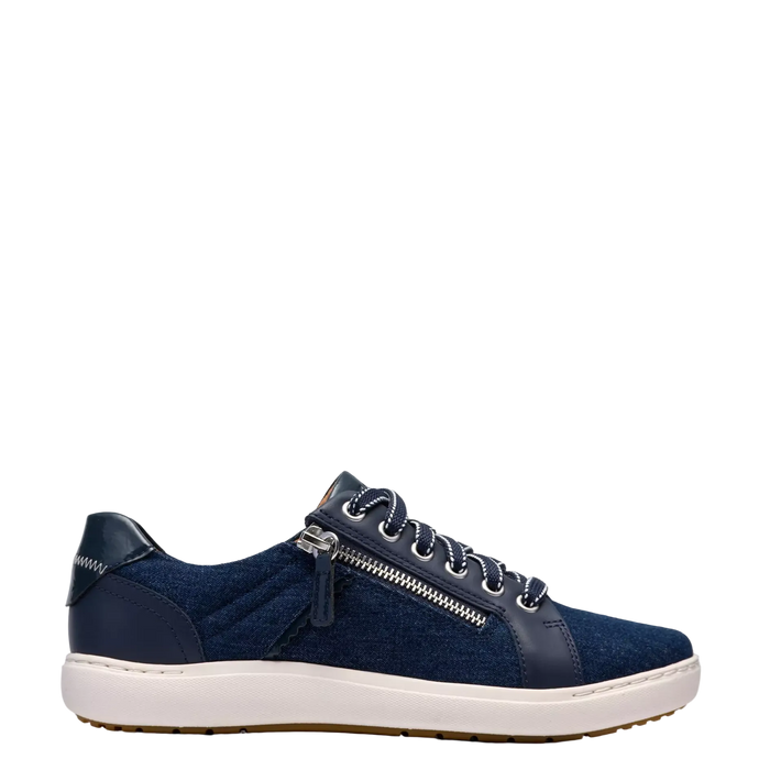 Navy blue sneaker with a white sole on a light gray background
