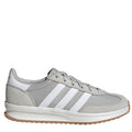 Gray sneaker with white stripes on a light gray background