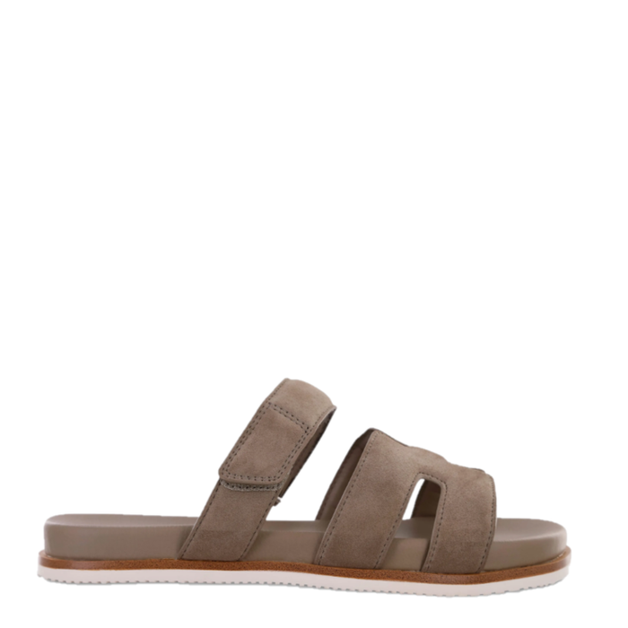 A brown, synthetic strappy sandal with a contoured footbed, featuring adjustable hook-and-loop strap details.